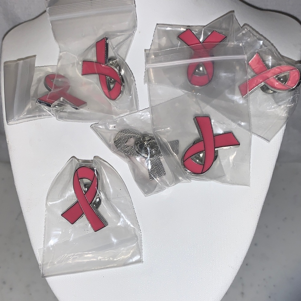 Pink Awareness Ribbon Pins There are 19 pins in the bag.